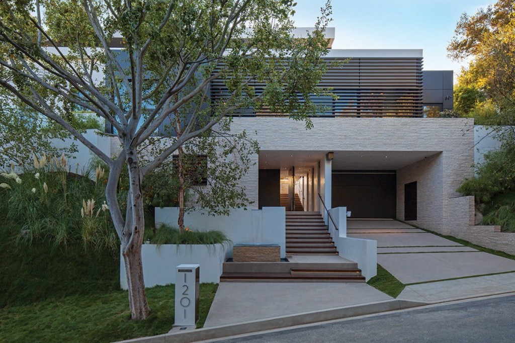 Laurel-Way-front-house-exterior-with-rough-split-faced-stone-clad-and-carport-garage-also-exston’s-Lime-based-plaster-and-dark-wenge-wood-design-ideas-1024x682