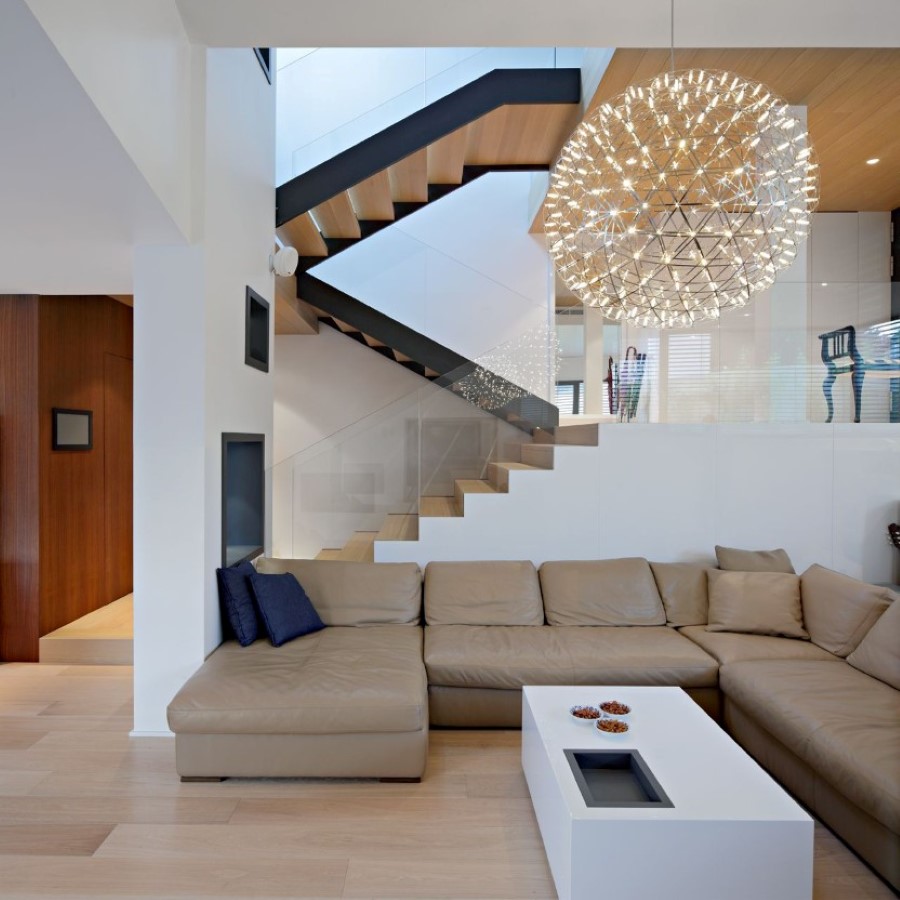 oversized-round-pendant-light-over-white-coffee-table-paired-with-brown-living-room-sectional-sofa-bed